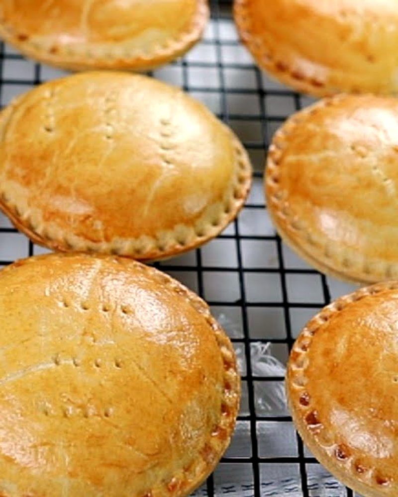 Golden mini chicken pies fresh from the oven